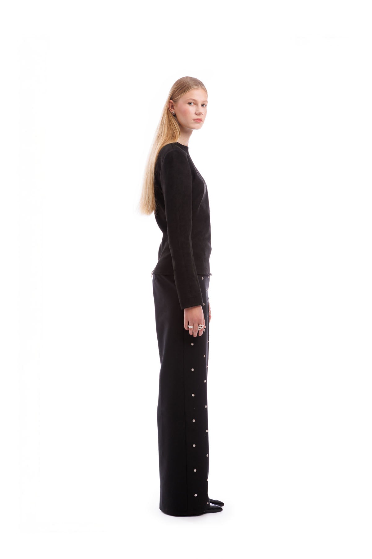 designer black top with long sleeves and sculpted waist structured fashion piece
