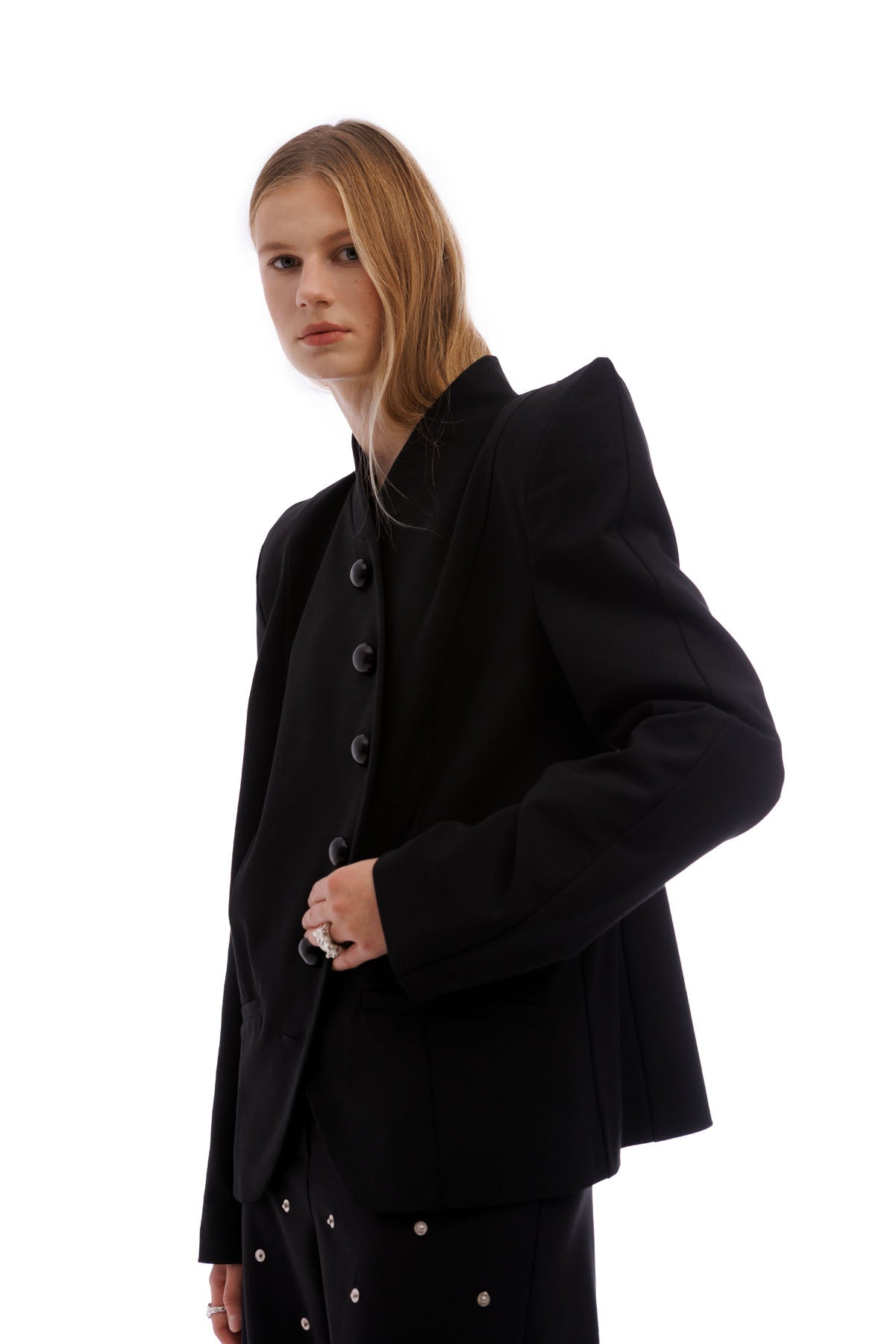 A606 black structured blazer with sharp shoulders minimalist designer jacket